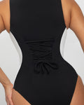Model wears Crewy Surfy Shapewear One Piece Swimsuit - Contour Black/White back view close up