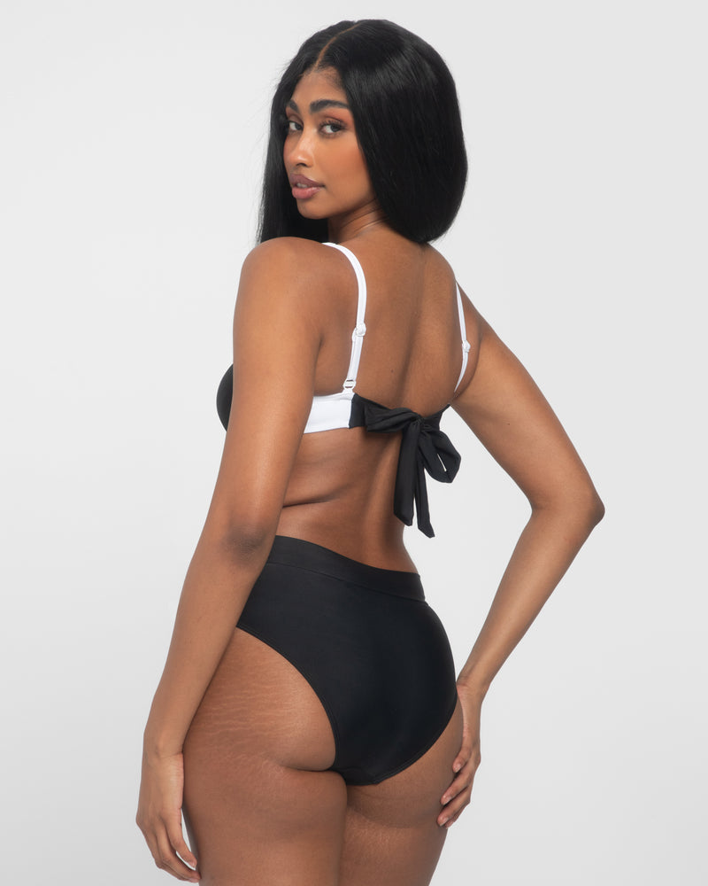 Model is wearing Sweetie Bikini Tie Back Underwire Top - Black/White with a matching bottom back view