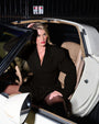 Model Sitting in a car Wears Convertible Blazer Mini Dress in black