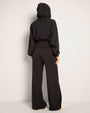 Full body back view of Cloudlined Corset Hoodie and Cloudlined Wide Leg Pant - Soft Black with hood on
