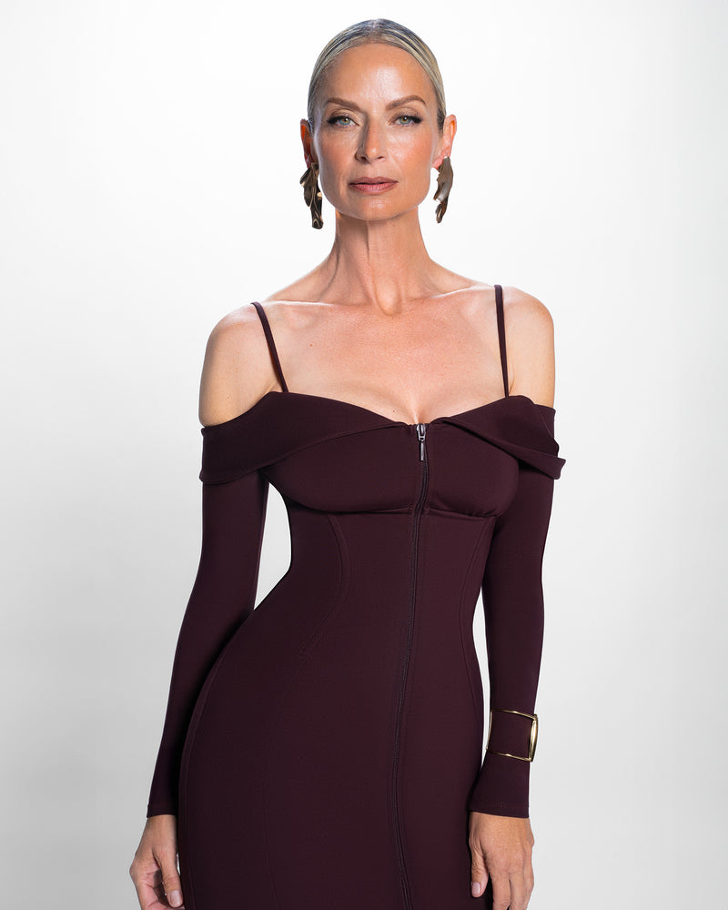 Model in Corsety Off Shoulder Long Sleeve Pencil Dress - Garnet with removable straps on