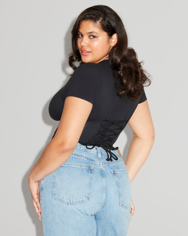 Model wears Short Sleeve Corsety Sculpting Shapewear Top - Black back view