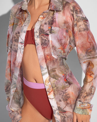 Model is posing in Flowy Oversized Collared Button Front Shirt - Soft Tropical close up front