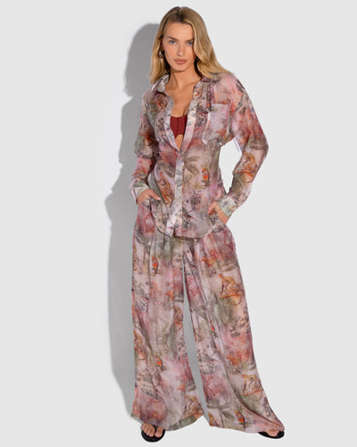 Model is posing in Flowy Pull On Wide Leg Pant - Soft Tropical and matching print long sleeve shirt front view