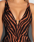 Model wears Plungey Triangle - Baked Clay Zebra/Black Tummy Control Shapewear Swimsuit deep plunge neckline close up