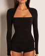 Model wears Shapey Ruched Long Sleeve Shapewear Top - Black front close up thumbholes in view