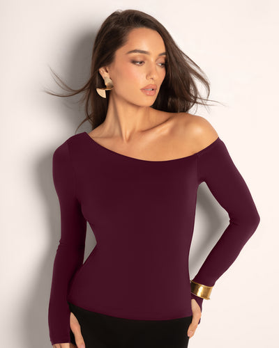 Model wearing Sculpty One Shoulder Long Sleeve Top - Garnet front view