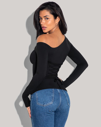 Model is posing in Shapey Long Sleeve One Shoulder Sculpting Shapewear Top - Black back view