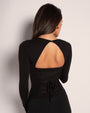 Model wears Sweetie Long Sleeve Sculpting Shapewear Top - Black open back view