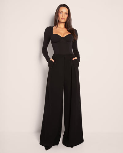Model wears Pleaty Wide Leg Pleated Pant - Black with top full front view