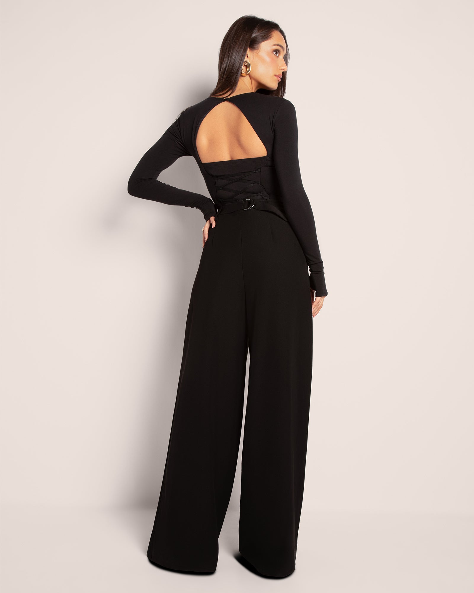 Model wears Pleaty Wide Leg Pleated Pant - Black with a top full back view