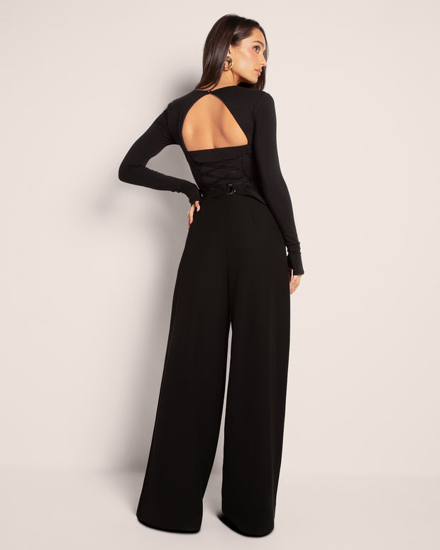 Model wears Pleaty Wide Leg Pleated Pant - Black with a top full back view
