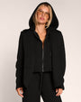 Model wearing Swuity Convertible Jacket - Black with hood on
