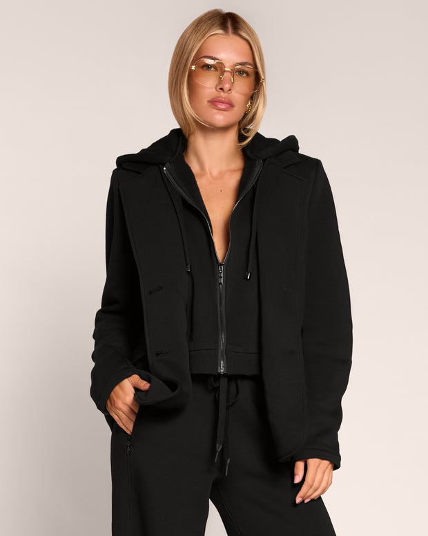 Front view of model wearing Swuity Convertible Jacket - Black