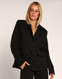 Model in Swuity Convertible Jacket - Black as a blazer front view