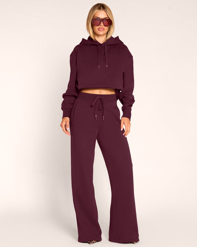 Full body front view of model in Fleecey Wide Leg Pull-On Pant - Garnet paired with Convertible Fleecey - Garnet