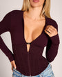 Bust clip detail of Corsety Long Sleeve Top - Lace Garnet/Garnet on model