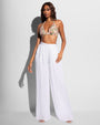 Model wearing Flowy Pant - Gauze White with a triangle bikini top