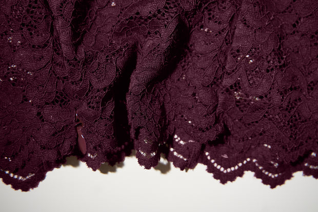 Close up detail shot of the bottom of Seamed Lushy Midi Dress - Lace Garnet