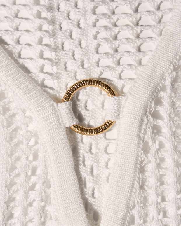 Detail shot of gold hardware on Ringy Mini Cover Up - Crochet White