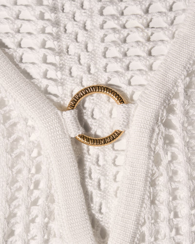 Detail shot of gold hardware on Ringy Mini Cover Up - Crochet White