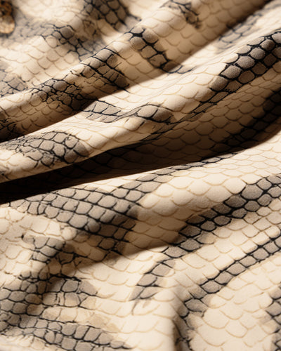 Fabric swatch of one-piece-swimsuit-tiger-chain-fabric-swatch