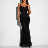 A woman modeling in a shaping top and a shaping maxi skirt