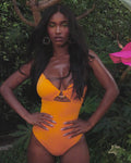 Video of model posing in Jeweled Cut Out Deep Plunge One Piece Shapewear Swimsuit - Orange