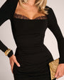 Close up of bust details of Shapey Ruched Long Sleeve Midi Dress - Black on model front view