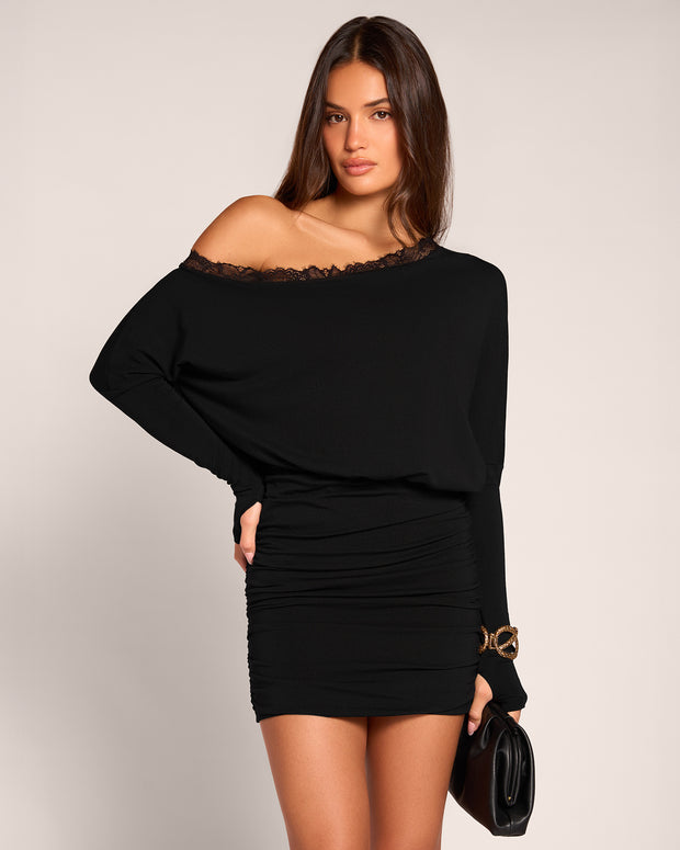 Model posing in Off Shoulder Long Sleeve Mini Dress - Black front view