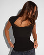 Model wearing Shapey Ruched Short Sleeve Top - Black paired with denim 