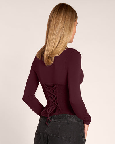 Back view of model in Corsety Long Sleeve Top - Lace Garnet/Garnet