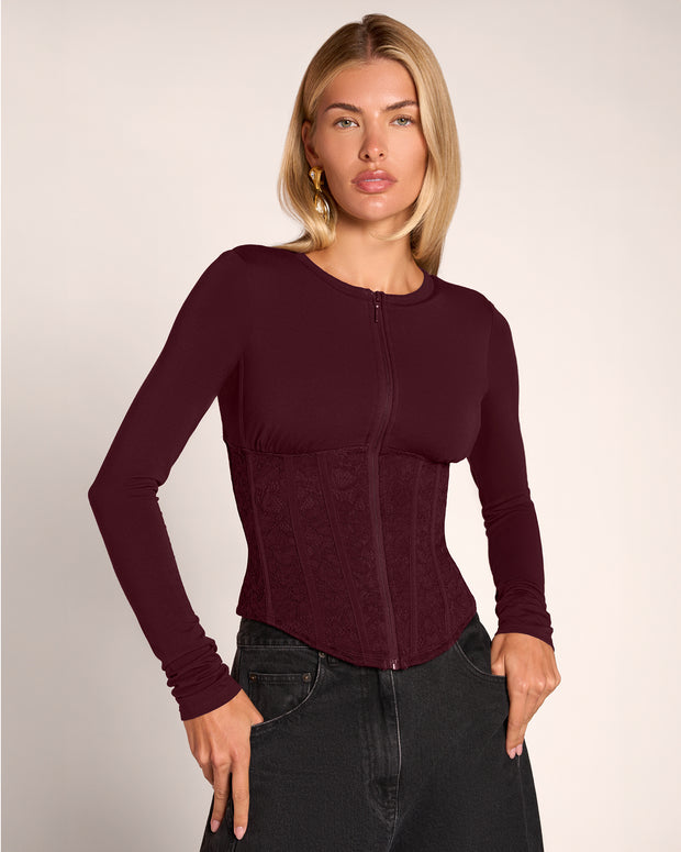Model wearing Corsety Long Sleeve Top - Lace Garnet/Garnet zipped up front view
