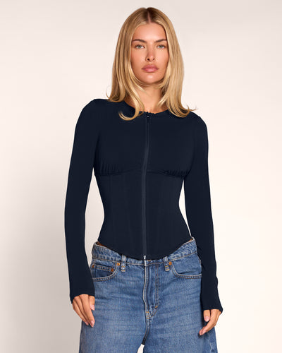 Model in Corsety Long Sleeve Top - Midnight zipped up