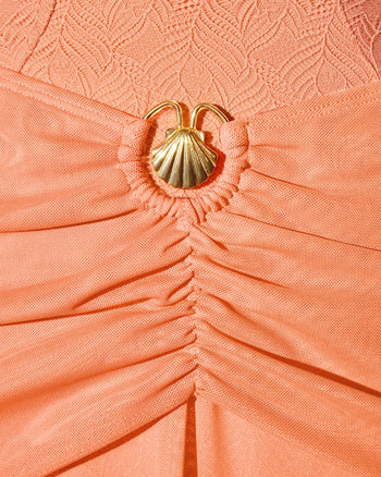 Detail shot of gold seashell hardware on Mermaid Sheer Maxi Skirty - Mesh Papaya/Gold Seashell