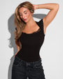 Front view of Shapey Ruched Short Sleeve Top - Black on model