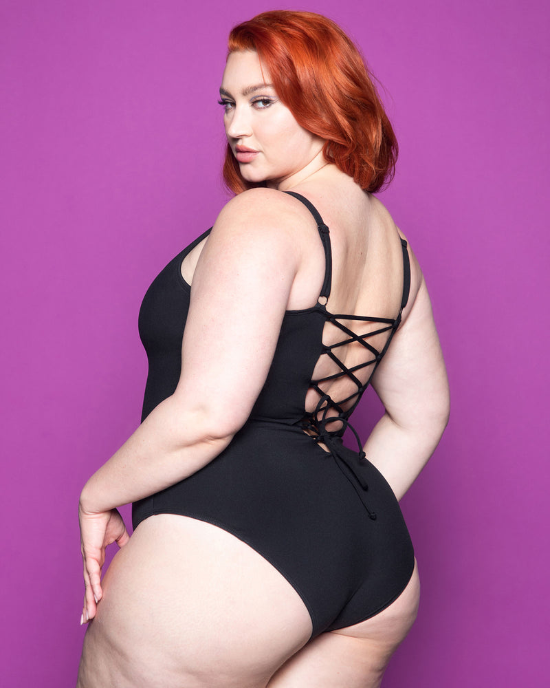 XL size Model wears Plungey - Black Open Back One Piece Shapewear Swimsuit back view